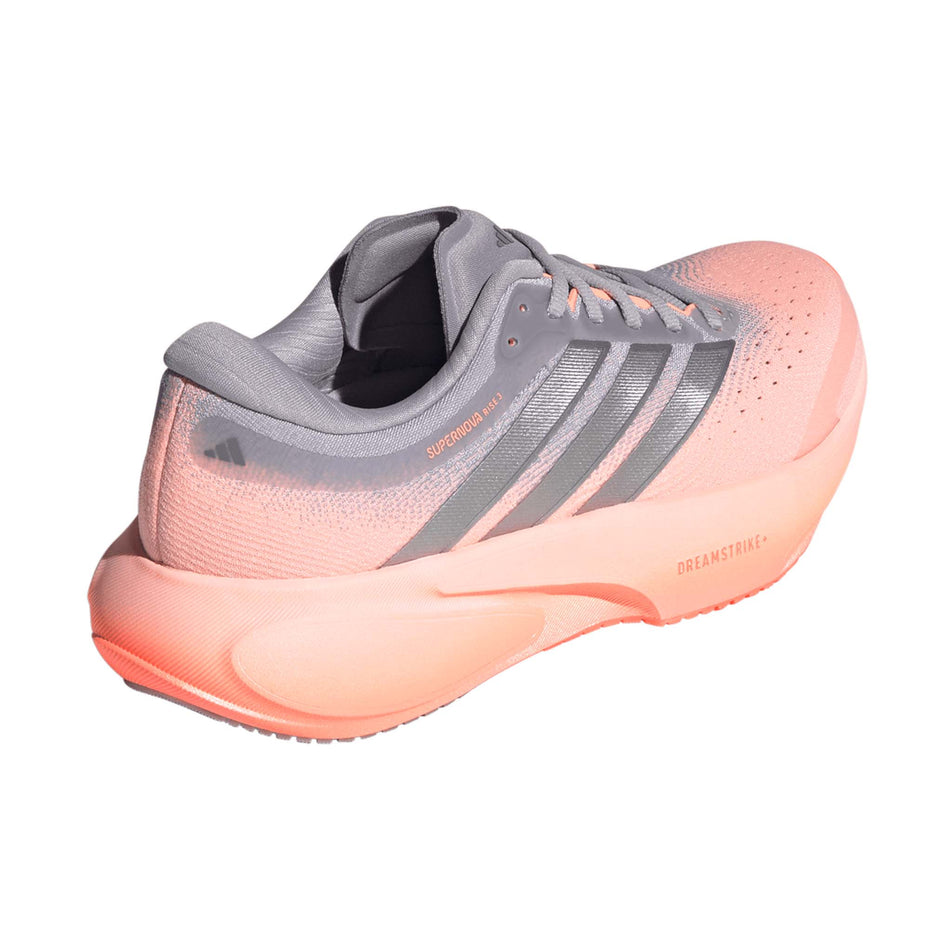 Lateral view of the right shoe from a pair of adidas Women's Supernova Rise 3 Running Shoes in the Clear Orange/Silver met./Glory Grey colourway.