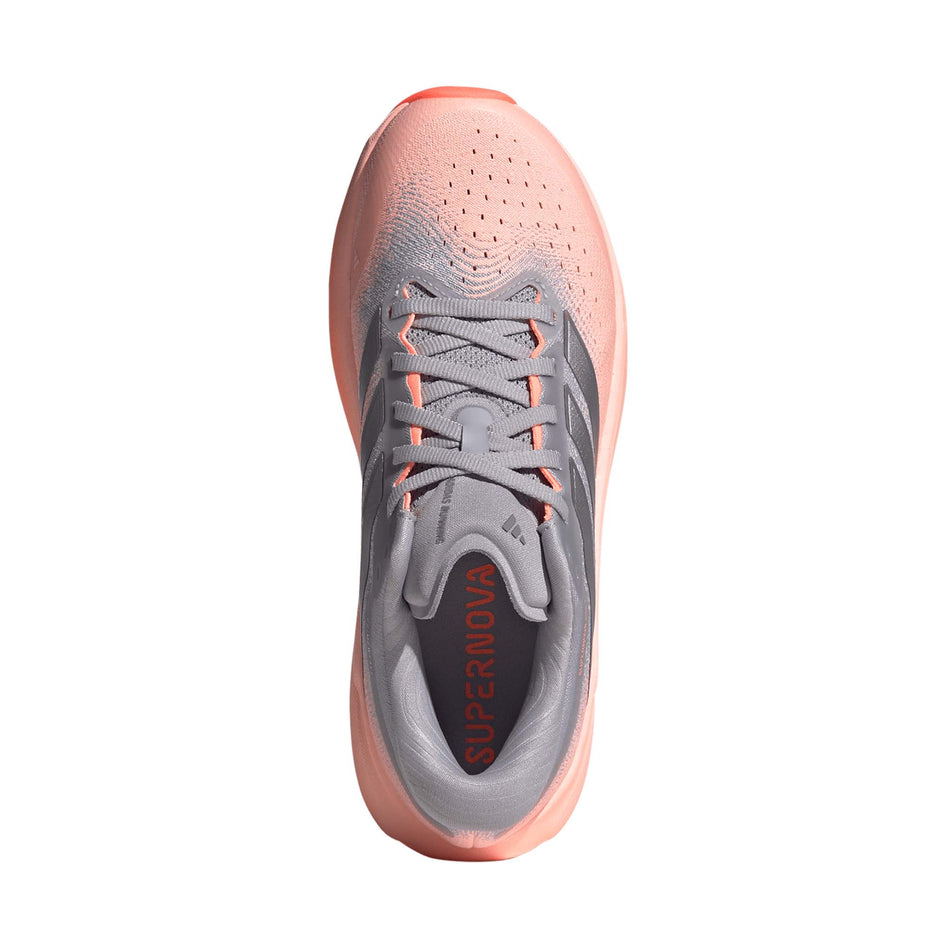 The upper of the right shoe from a pair of adidas Women's Supernova Rise 3 Running Shoes in the Clear Orange/Silver met./Glory Grey colourway.