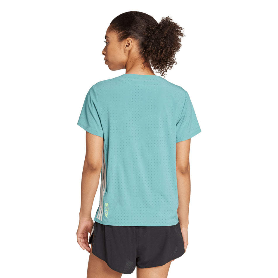 Back view of a model wearing the adidas Women's Adizero Tee in the Powder Teal colourway. (8665227231394)