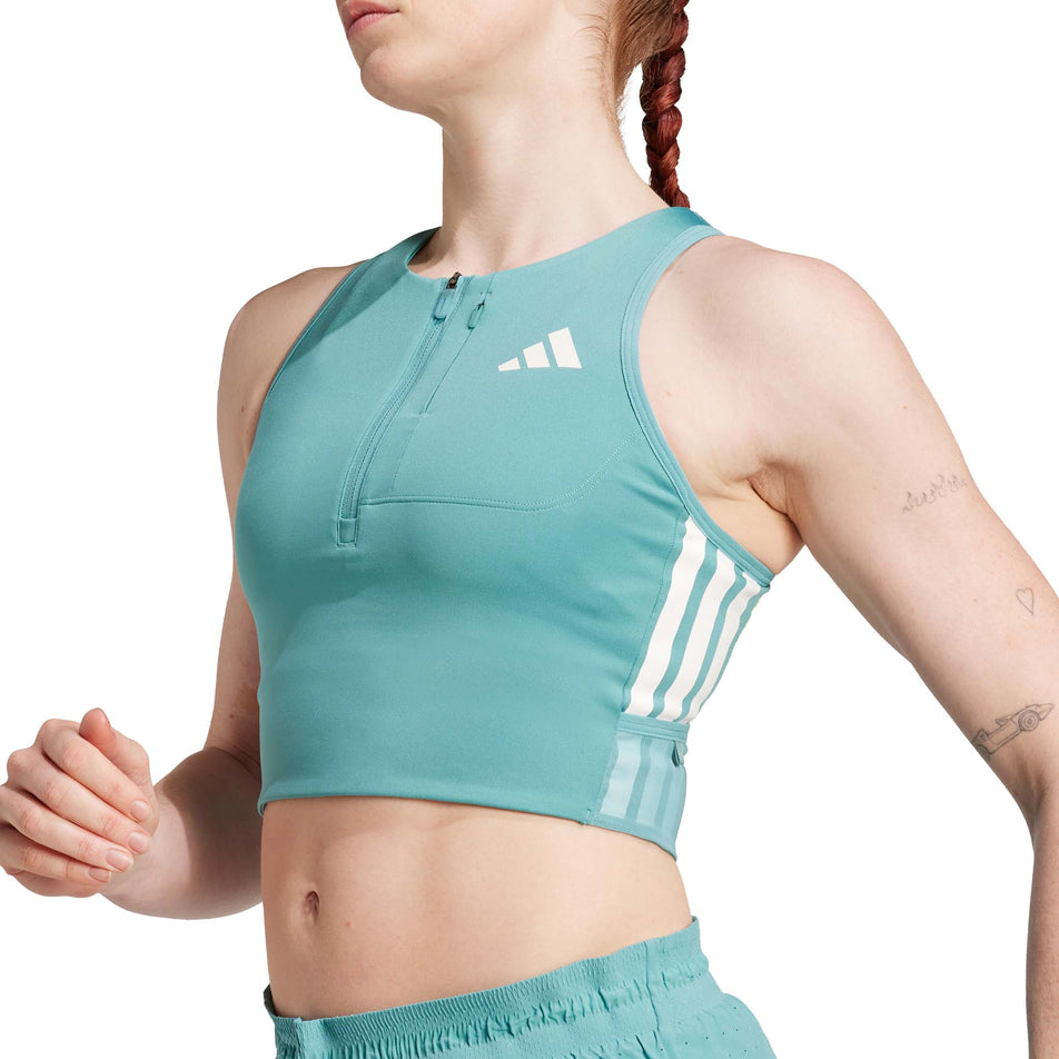 Front view of a model wearing the adidas Women's Adizero Crop in the Powder Teal colourway. 
 (8665221529762)