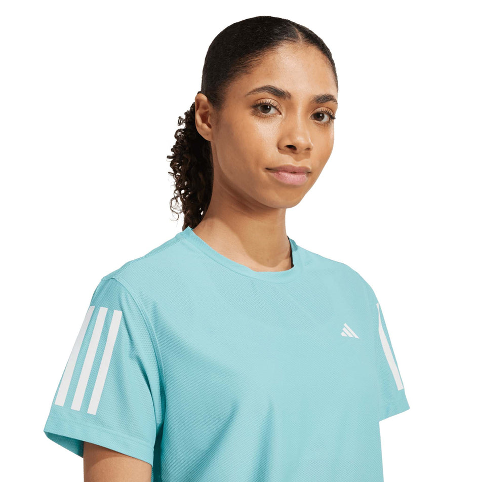 Front view of a model wearing the adidas Women's Own The Run Base Tee in the Mint Ton colourway. (8665229459618)