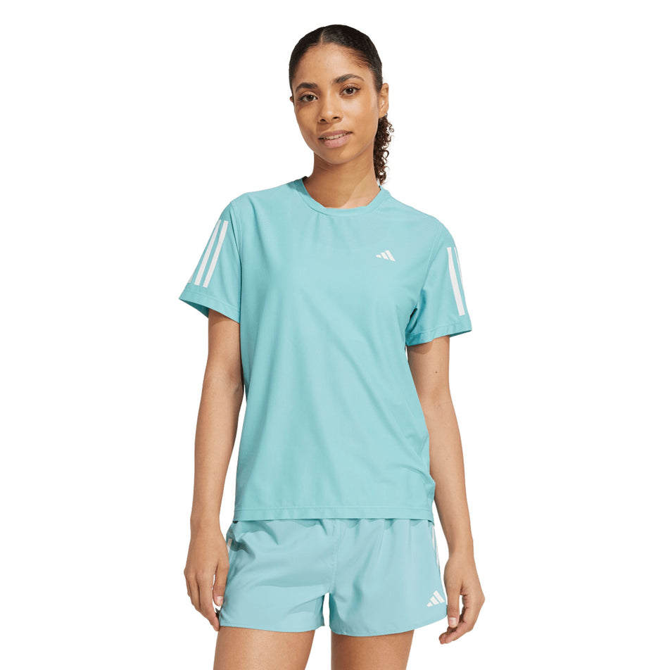 Front view of a model wearing the adidas Women's Own The Run Base Tee in the Mint Ton colourway. (8665229459618)