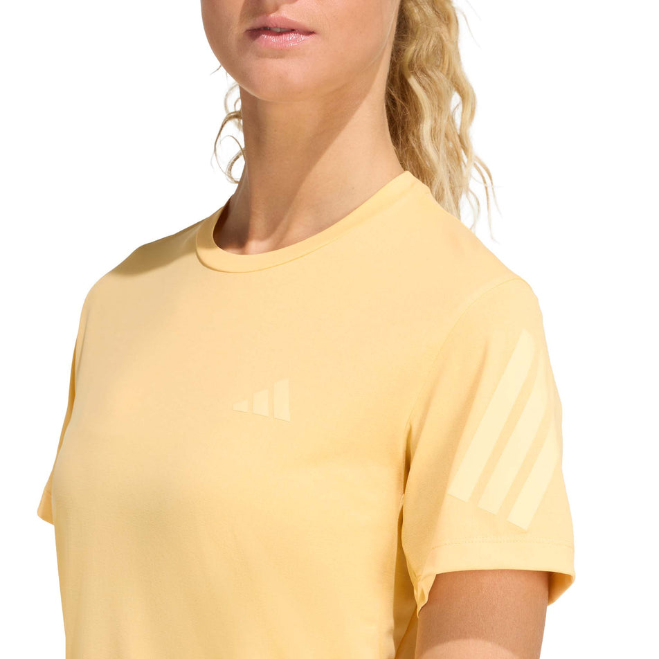 Front view of a model wearing the adidas Women's adi365 Tee in the Semi Ice Tangerine colourway.