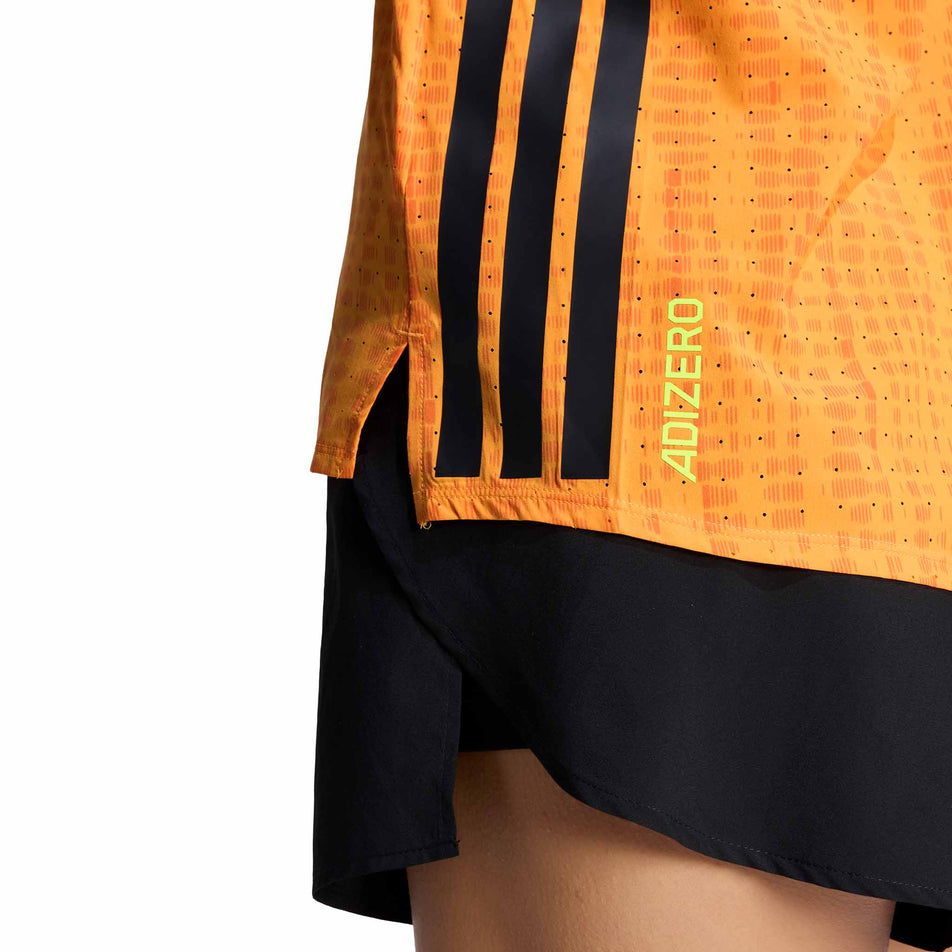 Close-up view of the Adizero branding on the adidas Women's Adizero Singlet in the Pure Tangerine/Pure Orange colourway.