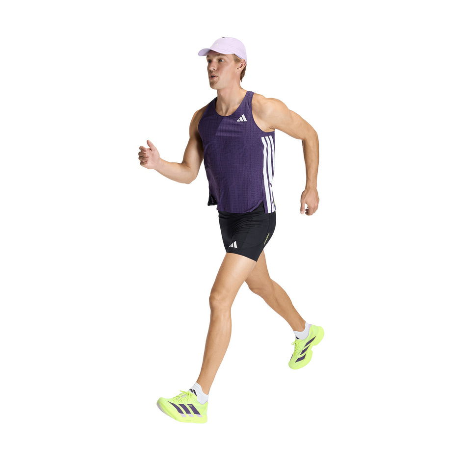 Angled view of a model wearing the adidas Men's Adizero Running Short Pocket Tights in the Black colourway.