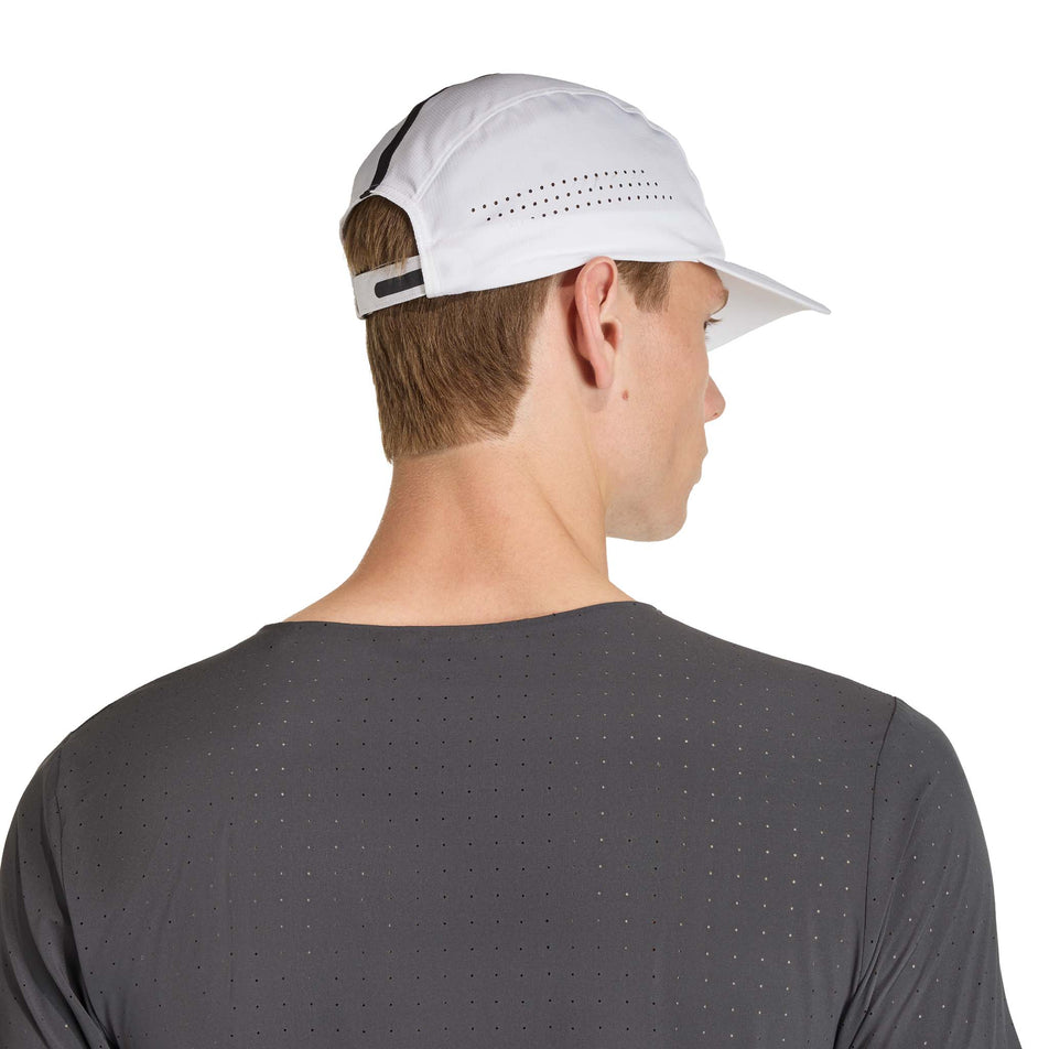 Back view of a model wearing the adidas Unisex Run x Adizero Cap in the White/Black colourway.