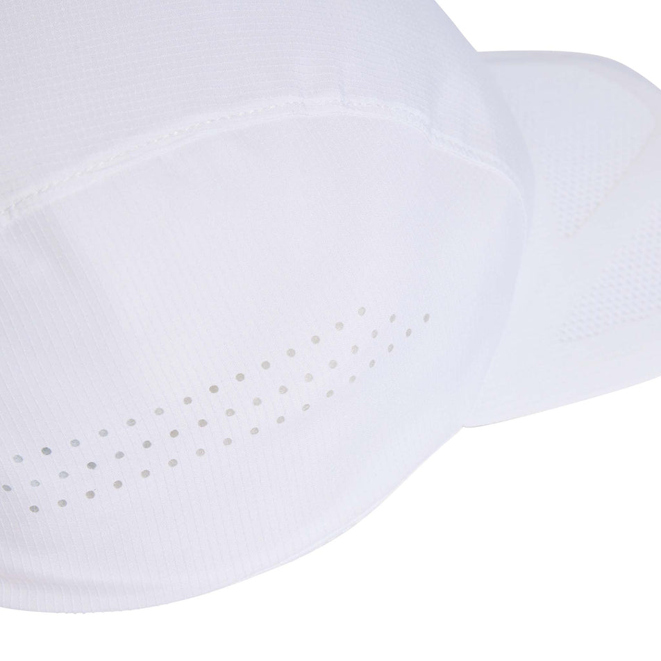 Side view of a model wearing the adidas Unisex Run x Adizero Cap in the White/Black colourway.