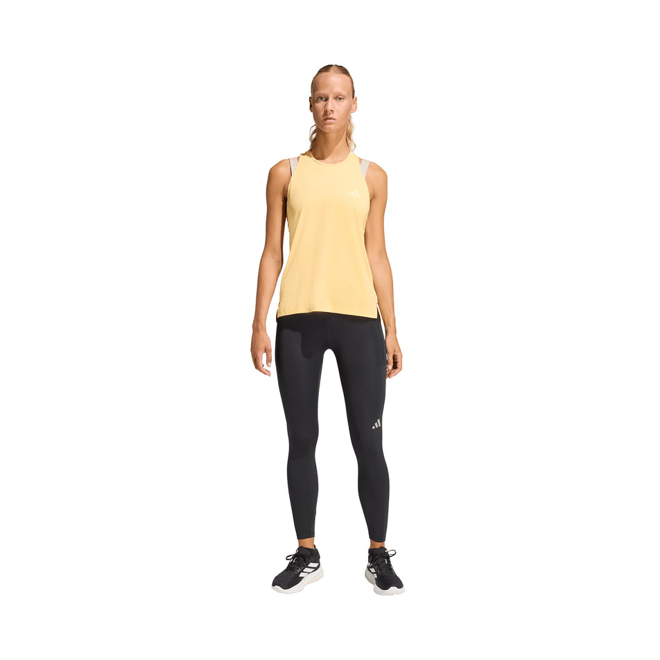 Front view of a model wearing the adidas Women's adi365 Climacool Tank Top in the Semi Ice Tangerine colourway.