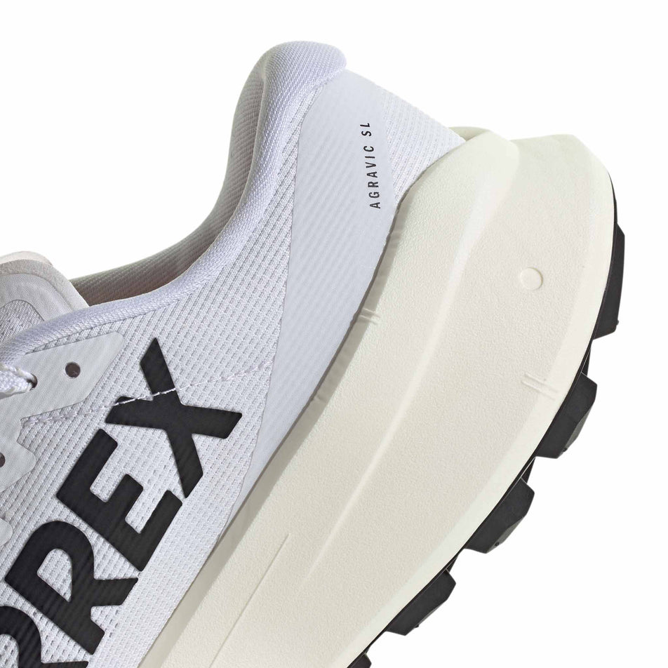 Medial view of the right shoe from a pair of adidas Women's Terrex Agravic SL Running Shoes in the Ftwr White/Core Black/Ftwr White colourway.
