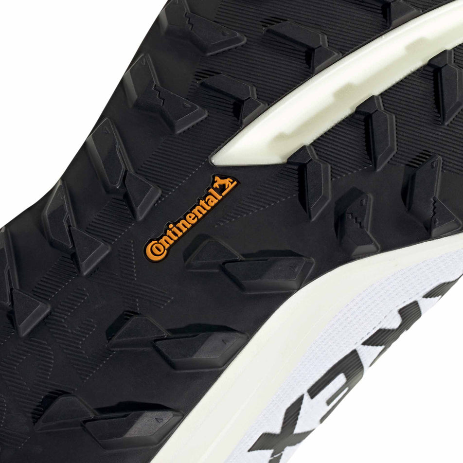 Close-up view of the outsole of the right shoe from a pair of adidas Men's Terrex Agravic SL Running Shoes in the Ftwr White/Core Black/Ftwr White colourway.