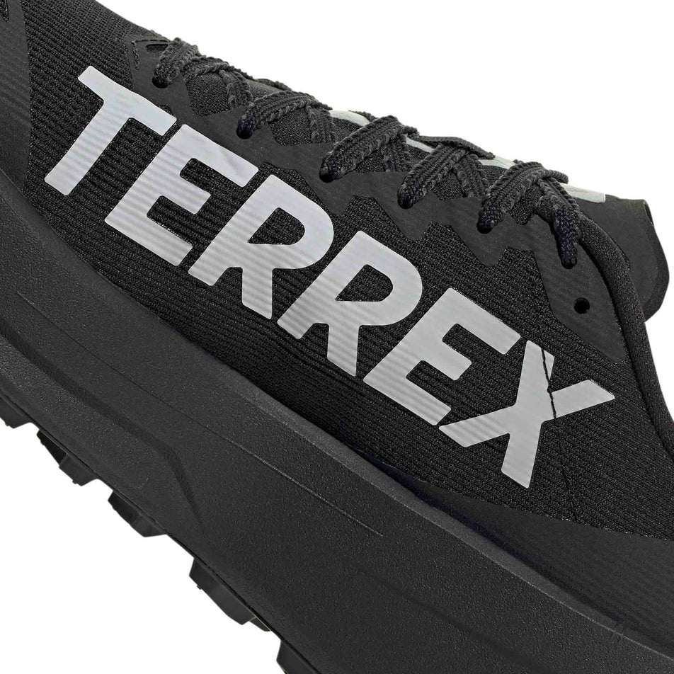 Medial view of the right shoe from a pair of adidas Men's Terrex Agravic SL Running Shoes in the Core Black/Grey Two/Core Black colourway.