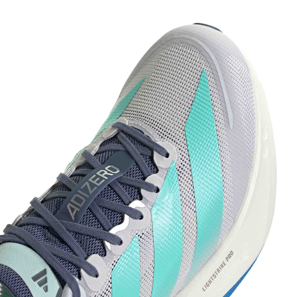 The upper of the toe box of the right shoe from a pair of adidas Men's Adizero Boston 13 Running Shoes in the Dash Grey/Flash Aqua/Halo Mint colourway.