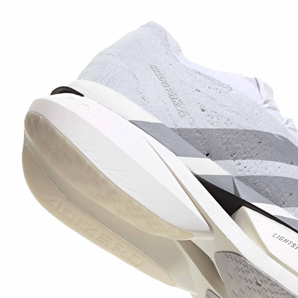 The rearfoot section of the right shoe from a pair of adidas Unisex Adizero Prime X3 Strung Running Shoes in the Ftwr White/Dash Grey/Grey Three colourway.
