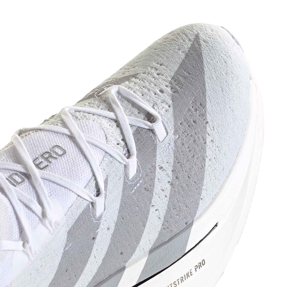 The toe box of the right shoe from a pair of adidas Unisex Adizero Prime X3 Strung Running Shoes in the Ftwr White/Dash Grey/Grey Three colourway.