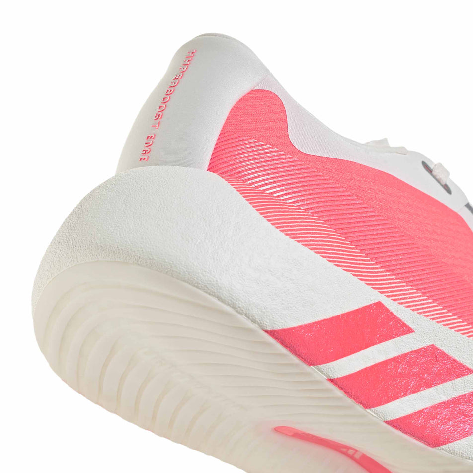 The rearfoot section of the right shoe from a pair of adidas Women's Hyperboost Edge Running Shoes in the Hyper White/Solar Turbo/Solar Turbo colourway.