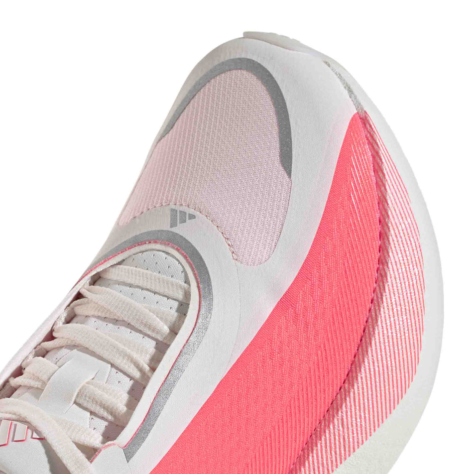 The toe box of the right shoe from a pair of adidas Women's Hyperboost Edge Running Shoes in the Hyper White/Solar Turbo/Solar Turbo colourway.
