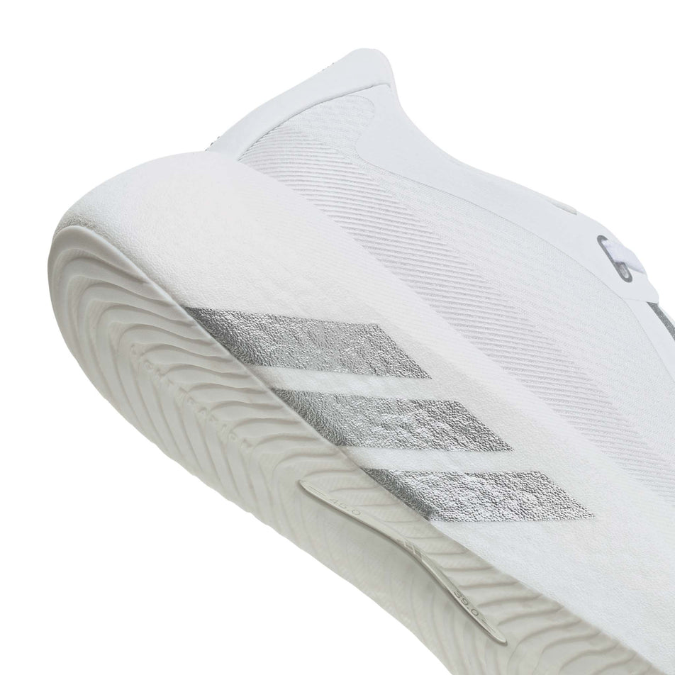 The rearfoot section of the right shoe from a pair of adidas Women's Hyperboost Edge Running Shoes in the Ftwr White/Silver Met./Zero Met. colourway.