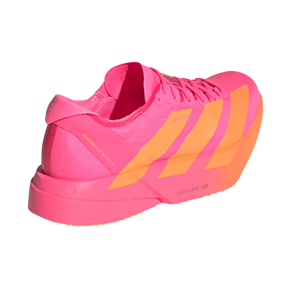 Lateral view of the right shoe from a pair of adidas Women's Adizero Adios Pro 4 Running Shoes in the Lucid Pink/Lucid Orange/Iron Met. colourway.