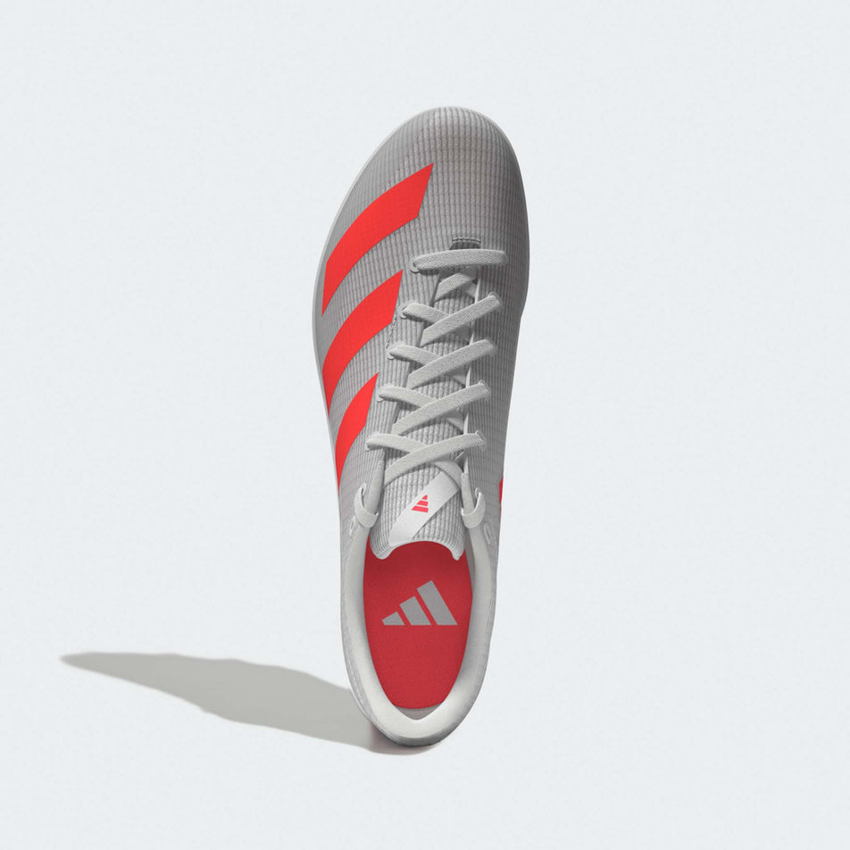 The upper of the left shoe from a pair of adidas Junior-Unisex Allroundstar Running Spikes in the Ftwr White/Solar Turbo/Gold Met. colourway.