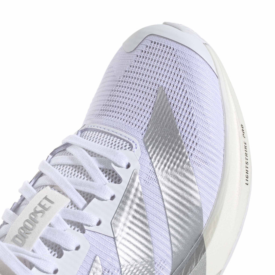 Close-up view of the toe box of the right shoe from a pair of adidas Women's Adizero Dropset Pro Shoes in the Footwear White/Silver Met./Footwear White colourway.
