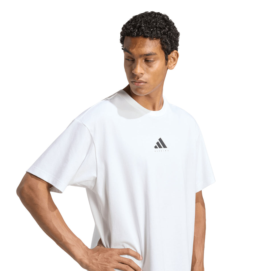 Front view of a model wearing the adidas Unisex Running Category Graphic T-Shirt in the White colourway.