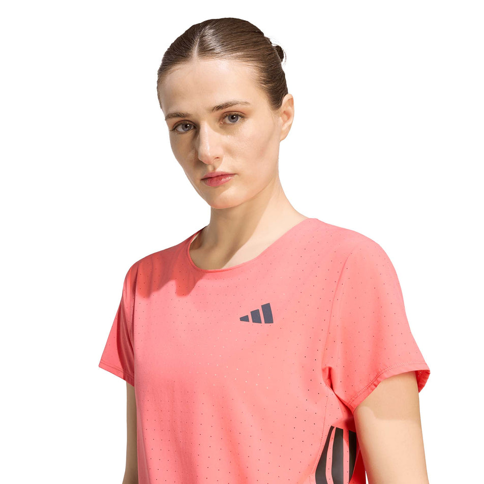 Front view of a model wearing the adidas Women's Adizero Tee in the Semi Turbo colourway.
