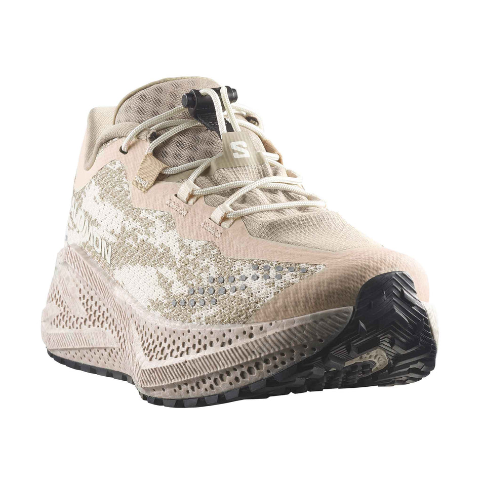 Lateral view of the right shoe from a pair of Salomon Women's Aero Glide 4 GRVL Running Shoes in the Tapioca/Desert Tan colourway.