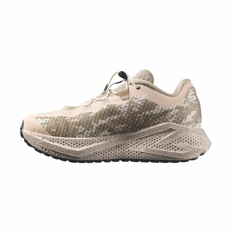 Medial view of the right shoe from a pair of Salomon Women's Aero Glide 4 GRVL Running Shoes in the Tapioca/Desert Tan colourway.