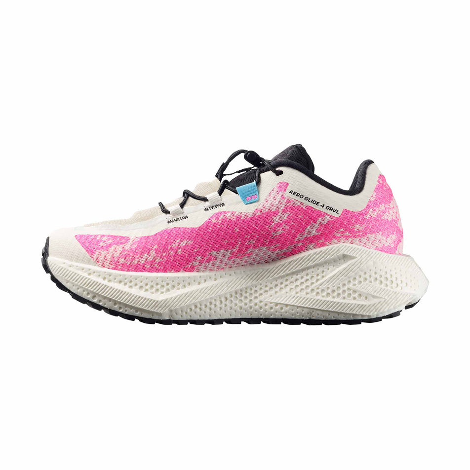 Medial view of the right shoe from a pair of Salomon Women's Aero Glide 4 GRVL Running Shoes in the Vanilla Ice/Knockout Pink/Black colourway.