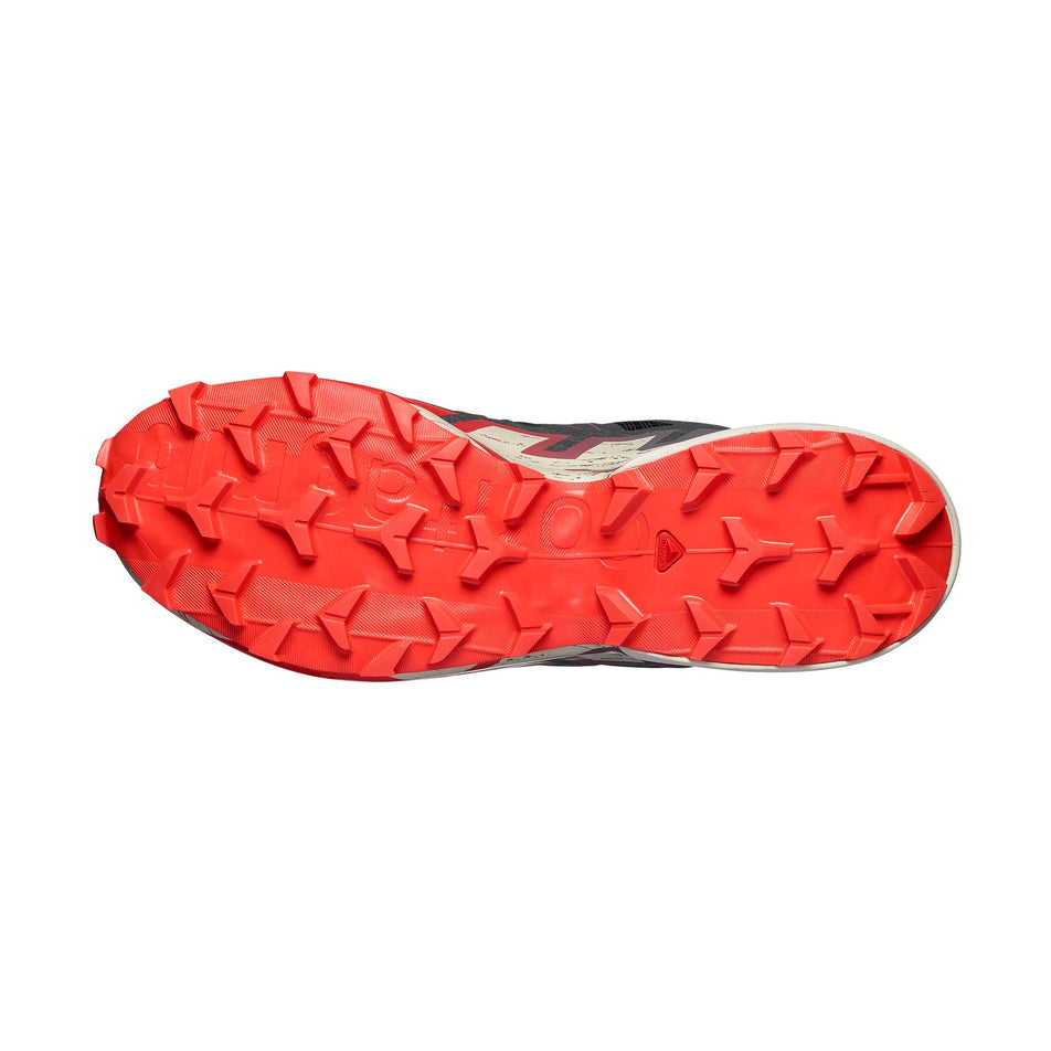 The outsole of the right shoe from a pair of Salomon Men's Speedcross 6 Running Shoes in the Black/Fiery Red/Almond Milk colourway.