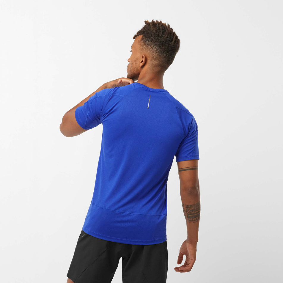 Back view of a model wearing a Salomon Men's Cross Run Short Sleeve T-Shirt in the Surf The Web colourway (8008549040290)