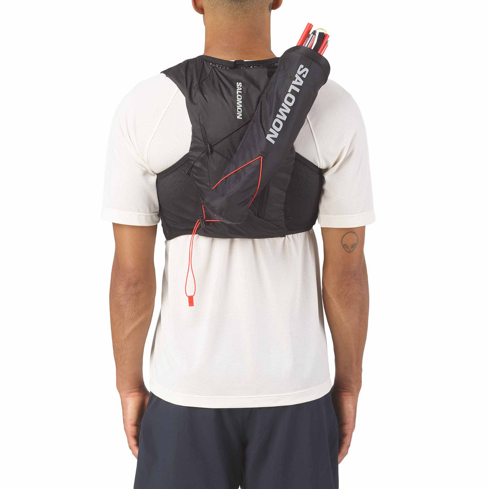 The Salomon Custom Quiver in the Black colourway attached to the back of a hydration vest.