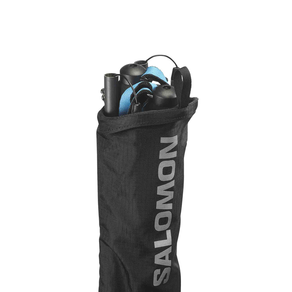Running poles stowed in the Salomon Custom Quiver in the Black colourway.