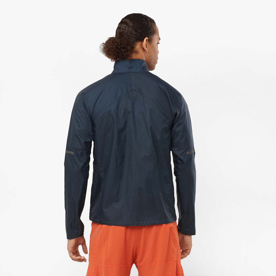 Back view of a model wearing a Salomon Men's Sense Flow Jacket in the Carbon/Carbon colourway (8071109771426)