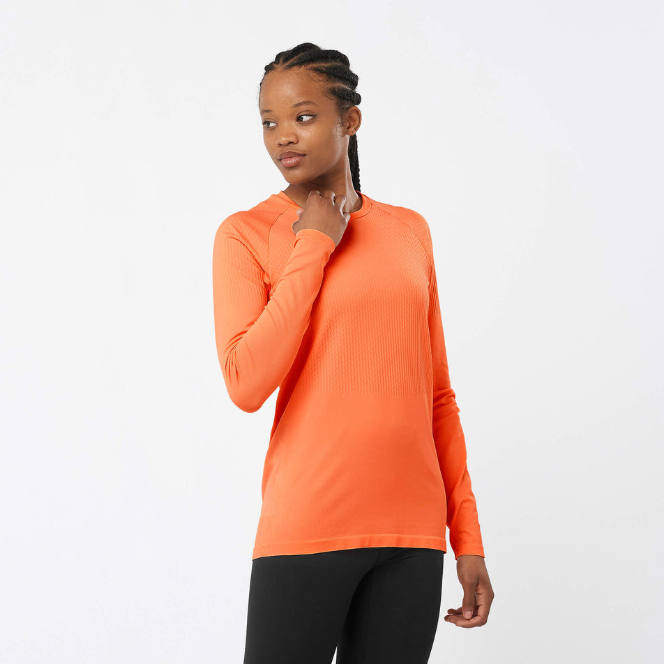 Front view of a model wearing a Salomon Women's Sense Aero Long Sleeve T-Shirt in the Burnt Ochre colourway (8000757301410)