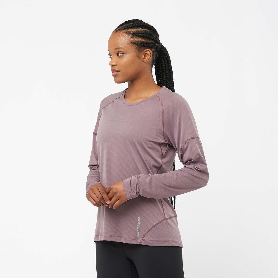 Angled front view of a model wearing a Salomon Women's Cross Run Long Sleeve T-Shirt in the Moonscape colourway (7999421317282)