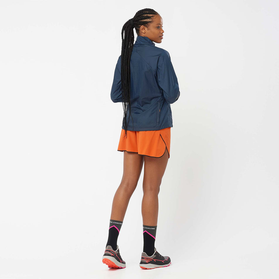 Back view of a model wearing a pair of Salomon Women's Sense Aero 5