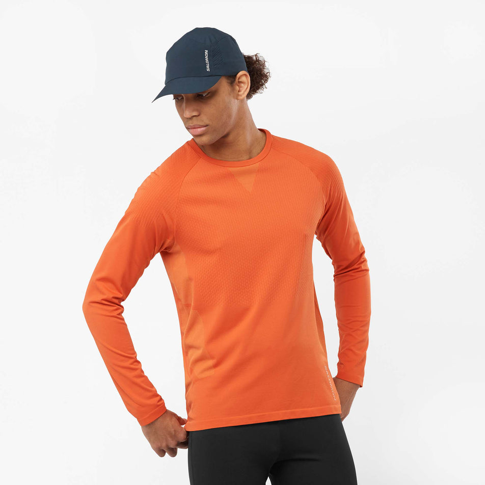 Front view of a model wearing a Salomon Men's Sense Aero Long Sleeve T-Shirt in the Burnt Ochre colourway (8008567488674)