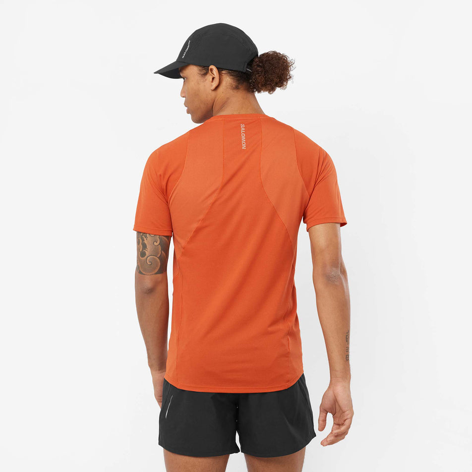 Back view of a model wearing a Salomon Men's Sense Aero Short Sleeve T-Shirt in the Burnt Ochre colourway (8008572928162)