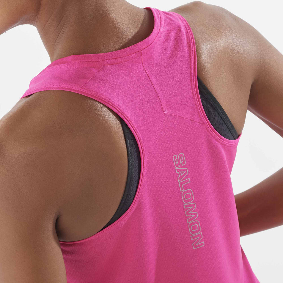 Close-up back view of a model wearing a Salomon Women's Sense Aero Singlet in the Beetroot Purple colourway. (8311884054690)