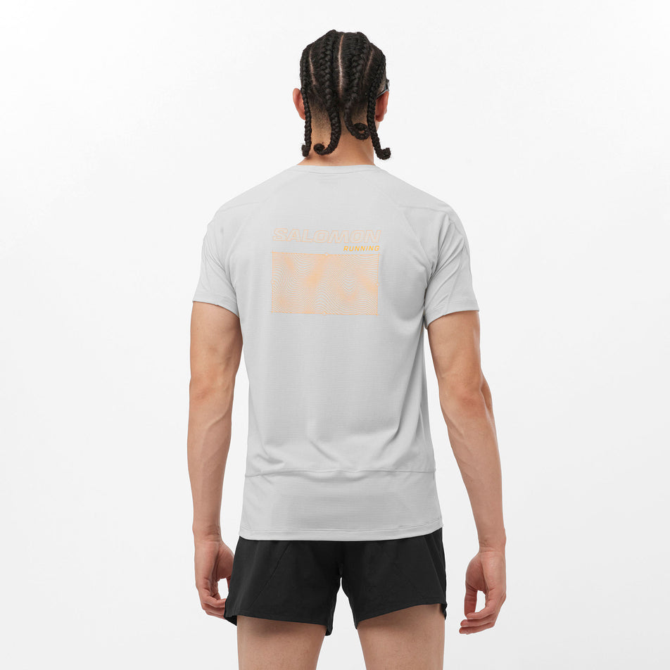 Back view of a Salomon Men's Cross Run GFX Tee in the Gray Violet colourway. Model is also wearing sunglasses and Salomon legwear. (8311807705250)