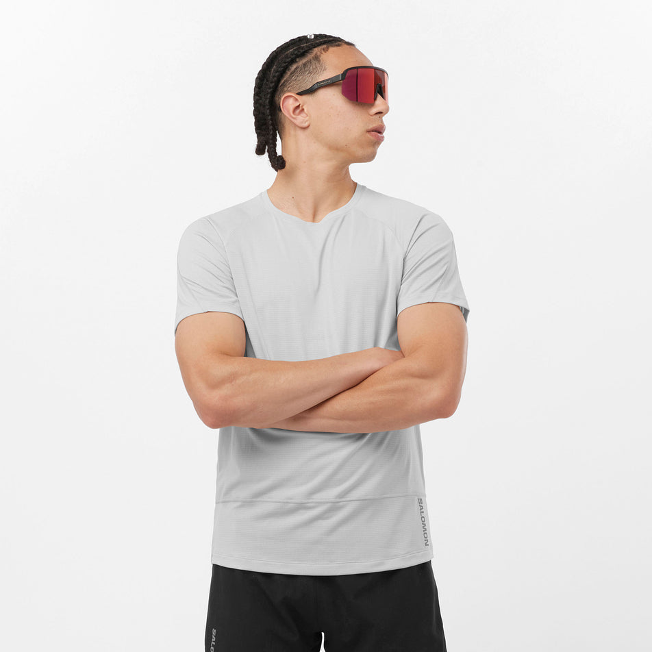 Front view of a Salomon Men's Cross Run GFX Tee in the Gray Violet colourway. Model is also wearing sunglasses and Salomon legwear. (8311807705250)