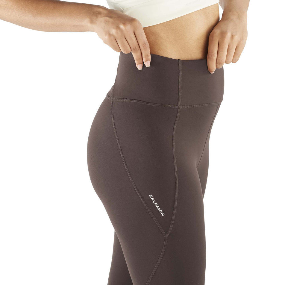 Angled view of a model wearing the Salomon Women's SHAKEout BLISS 25