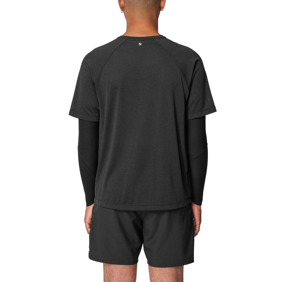 Back view of a model wearing the Salomon Men's SHKout Core SS Tee in the Deep Black colourway.