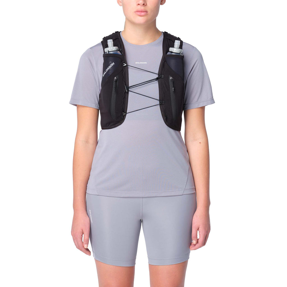 Front view of a model wearing the Salomon Unisex ADV Skin 12 Running Vest in the Black colourway.