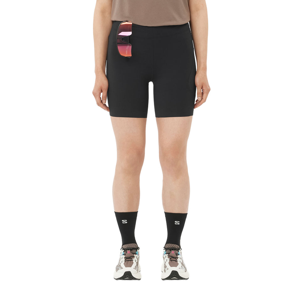 Front view of a model wearing the Salomon Women's Sense Stow Short Tights 6
