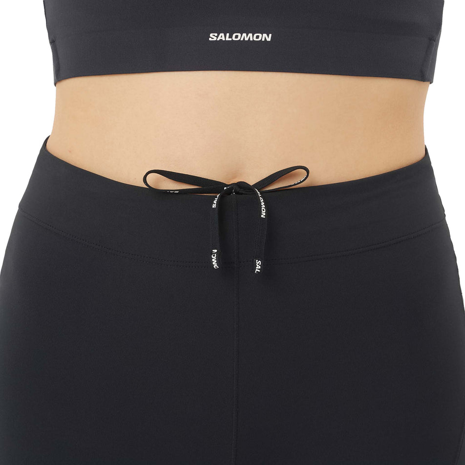 Front view of a model wearing the Salomon Women's Sense Stow Short Tights 6