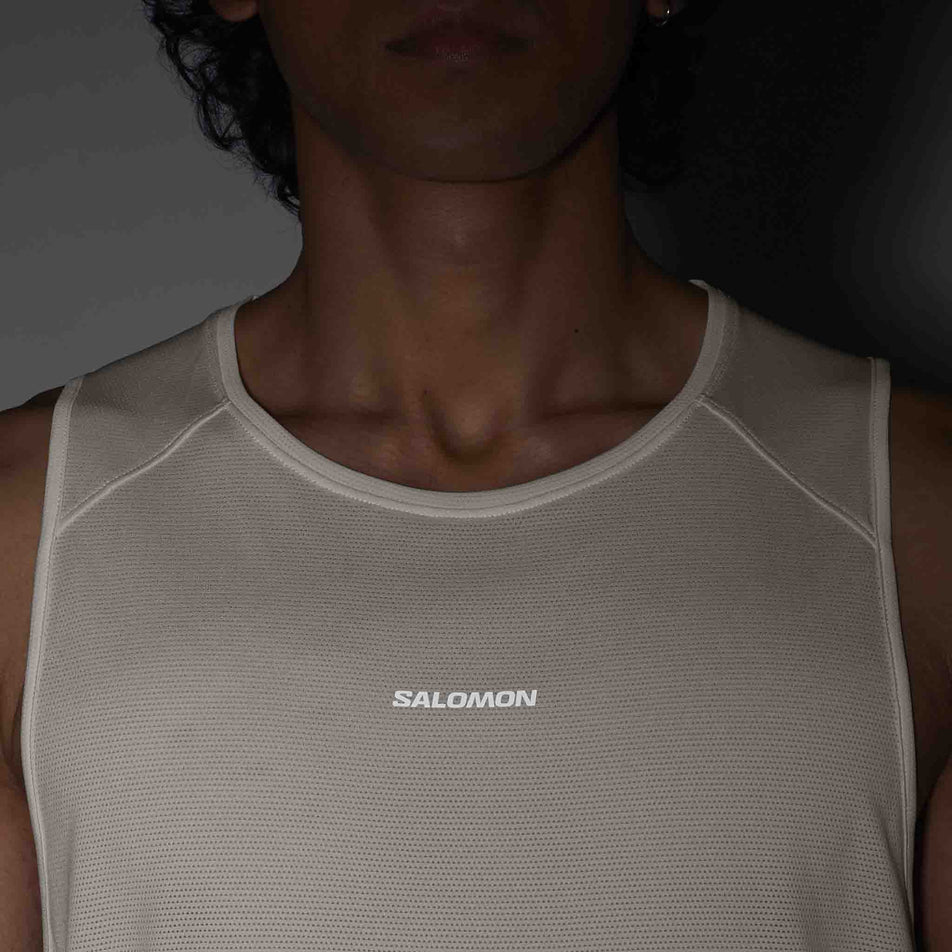 Front view of a model wearing the Salomon Men's Shakeout Core Tank in the Whisper White colourway.