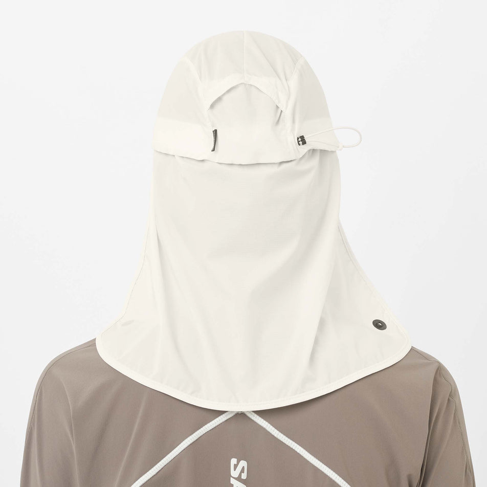 Back view of a model wearing the Salomon Unisex Sahara Cap in the Whisper White colourway.