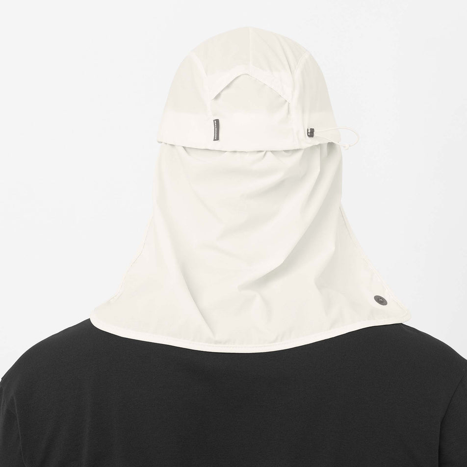 Back view of a model wearing the Salomon Unisex Sahara Cap in the Whisper White colourway.